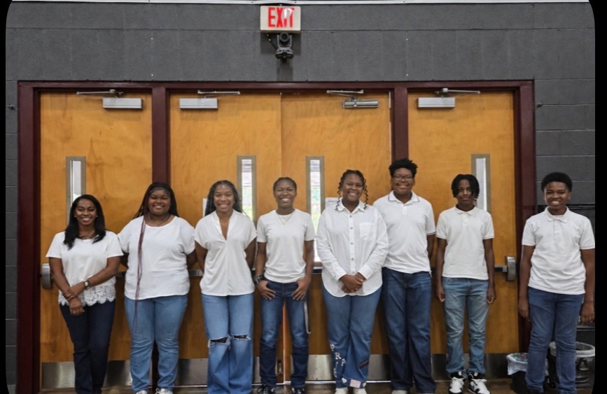 CEC Youth Ushers standing together inside the church